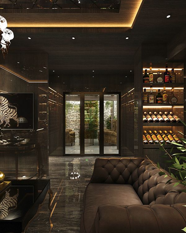 Private salon with tufted leather seating and backlit walls