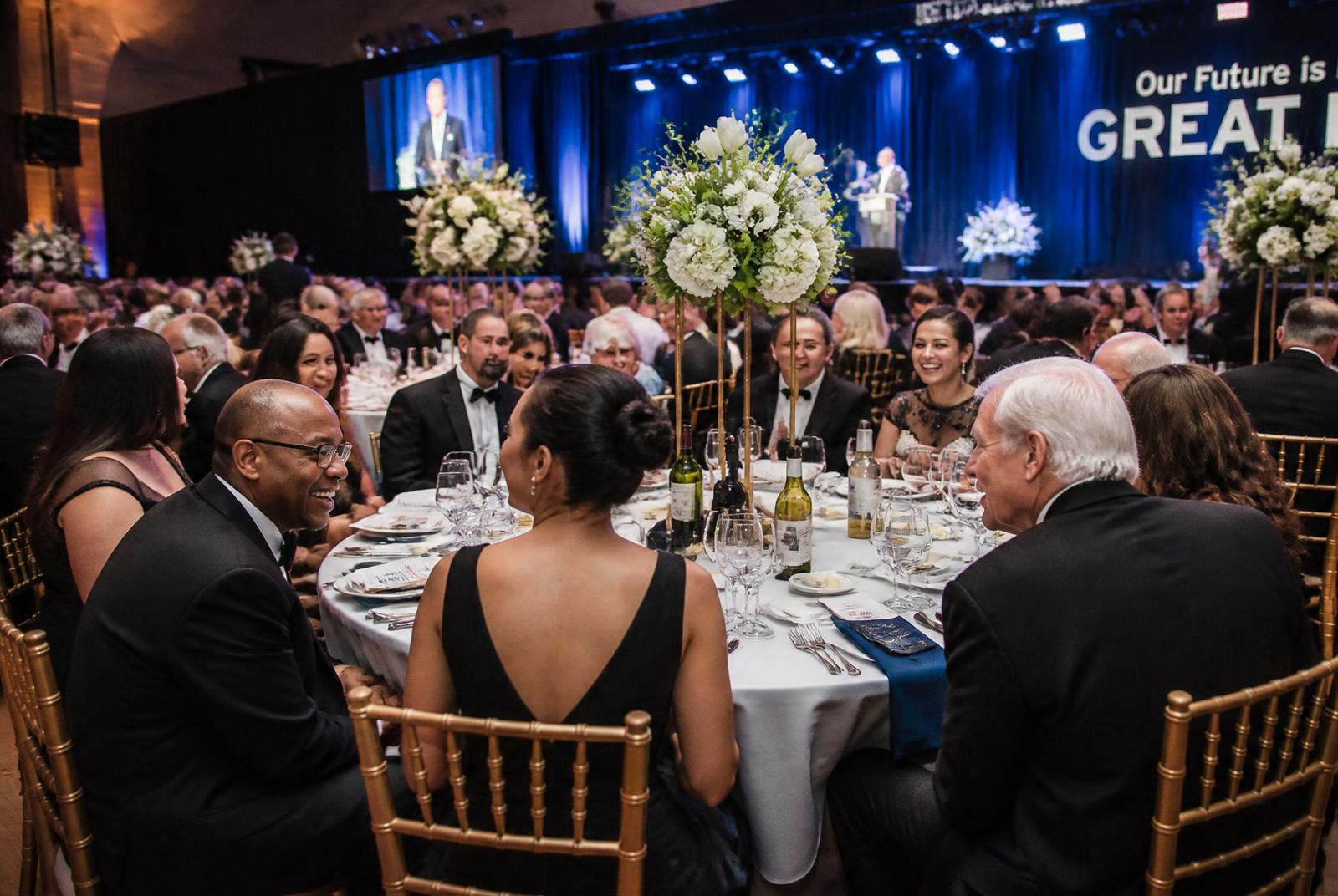 Black tie charity gala in a marble hall