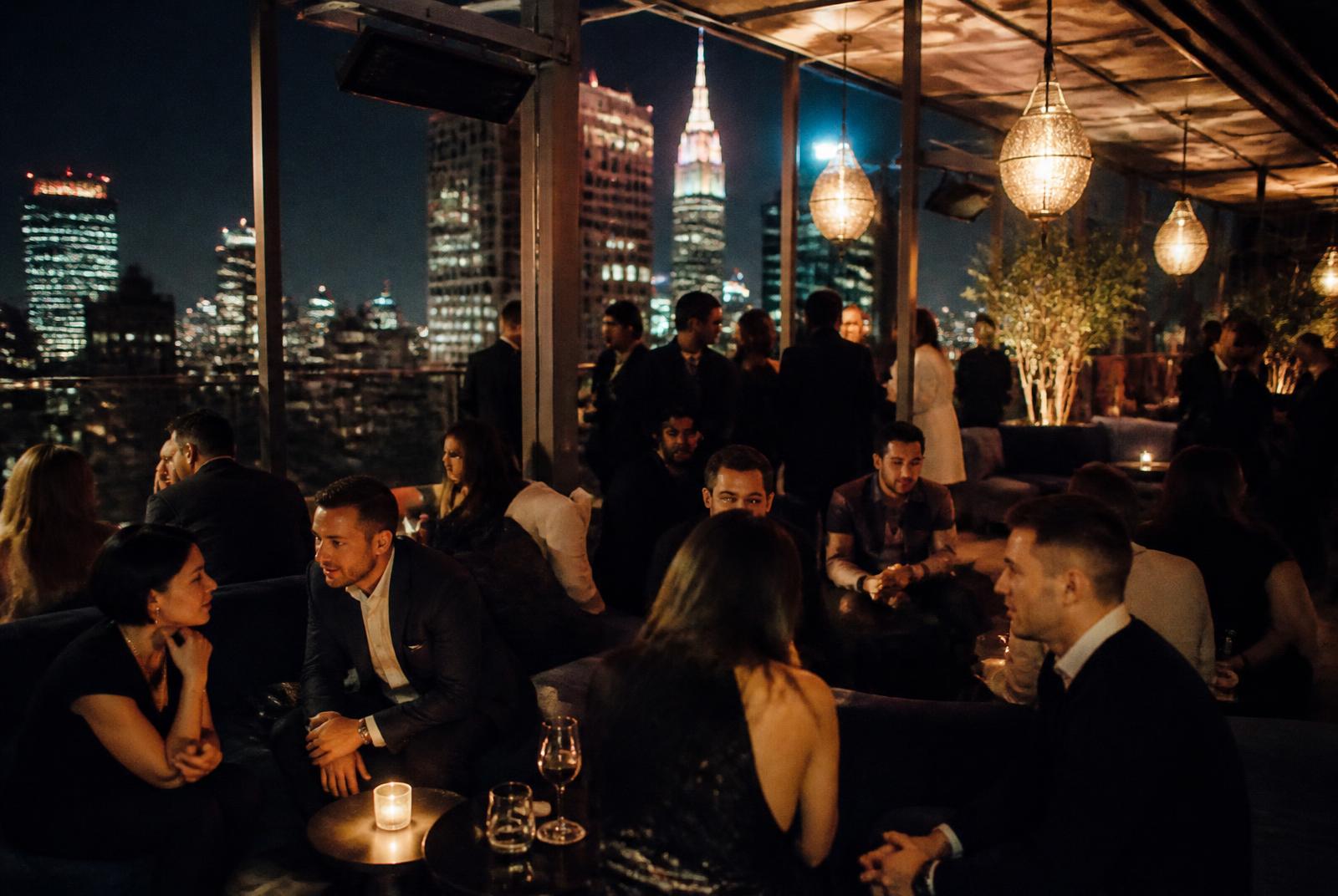 Luxury rooftop gathering at night